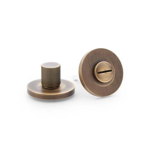 Alexander & Wilks AW792AB, Reeded Bathroom Turn & Release in Antique Brass.